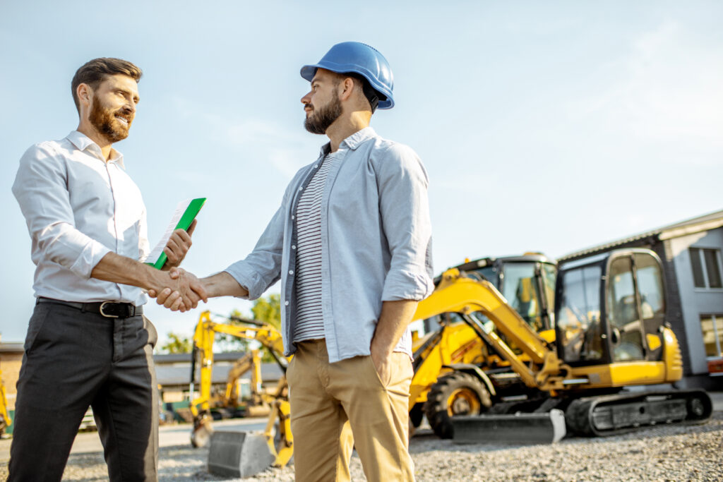 Foundation Support Systems New York - A Contractor Shaking Hands with a Property Owner