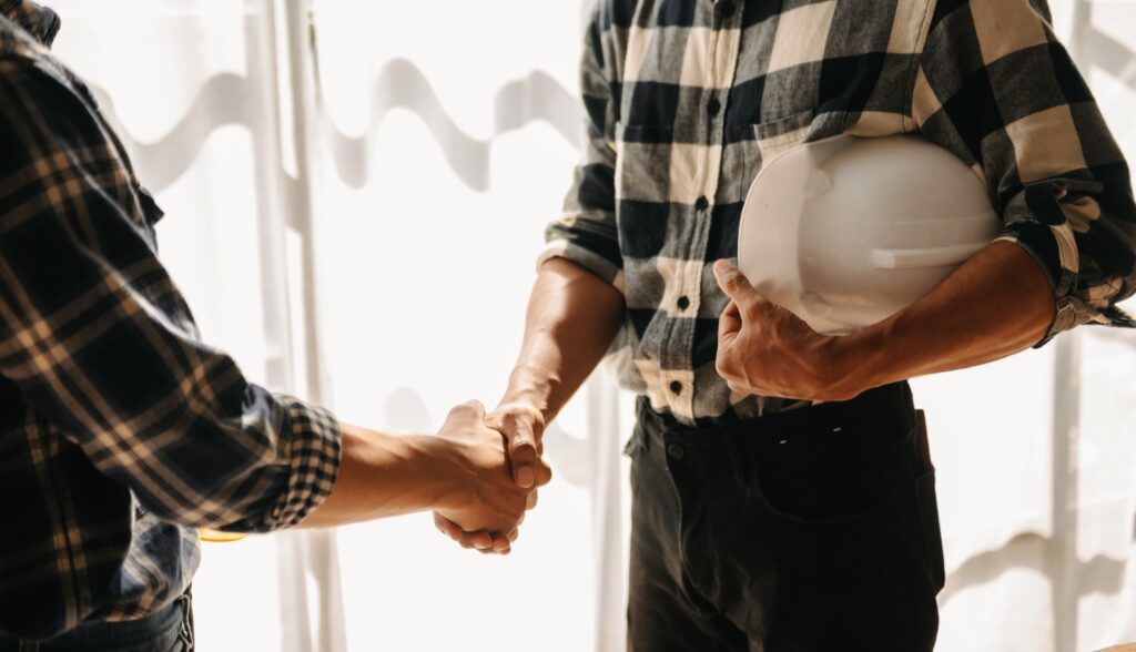 Underpinning Contractors New York - A Contractor and a Homeowner Shaking Hands