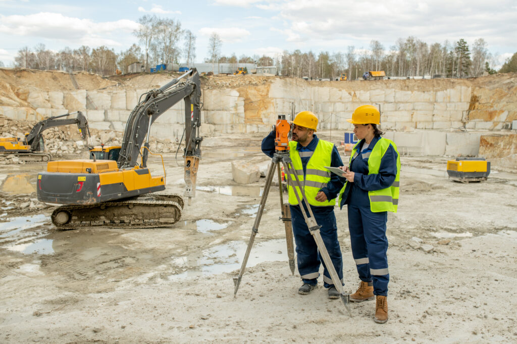 Compaction Grouting Services New York - Two Man Standing in Front of a Tractor