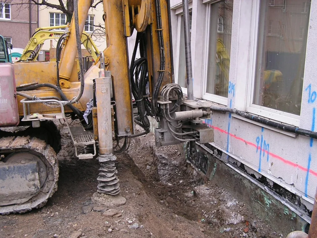 Permeation Grouting - A Grouting Machine Near a House for an Underpinning Project