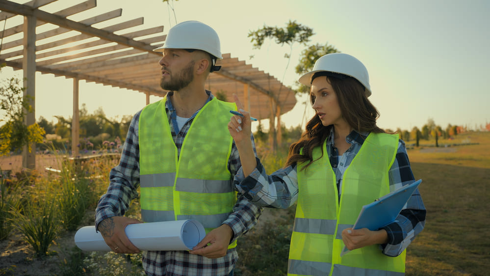 Cone Penetration Test - Two Construction Workers Scoping Out a Construction Site