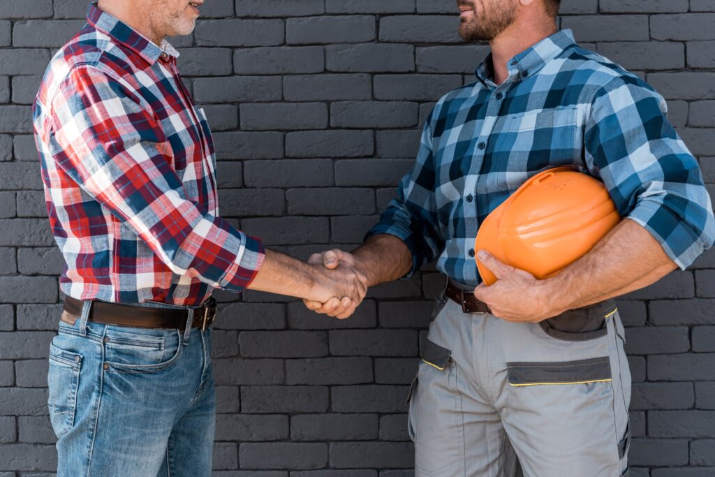 Crawl Space Stabilizer Contractors in New York - A Picture of a Contractor Shaking Hands with a Homeowner