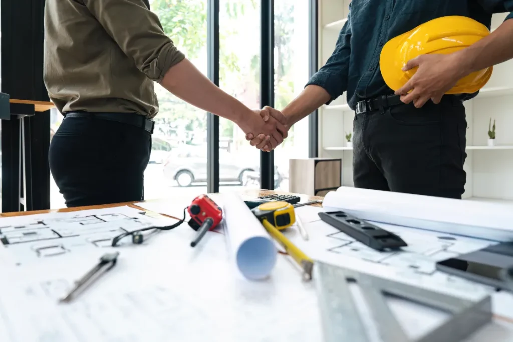 Pile Load Testing Contractors in New York - A Contractor Shaking Hands with a Homeowner