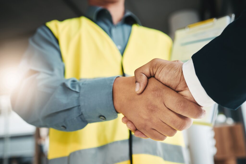 Foundation Underpinning Contractors in New York - A Contractor Shaking Hands with a Business Owner