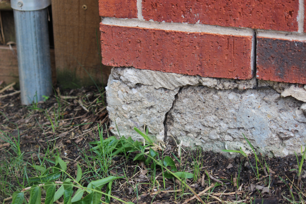 Foundation Repair Methods - A Cracked Foundation at the Corner of a House