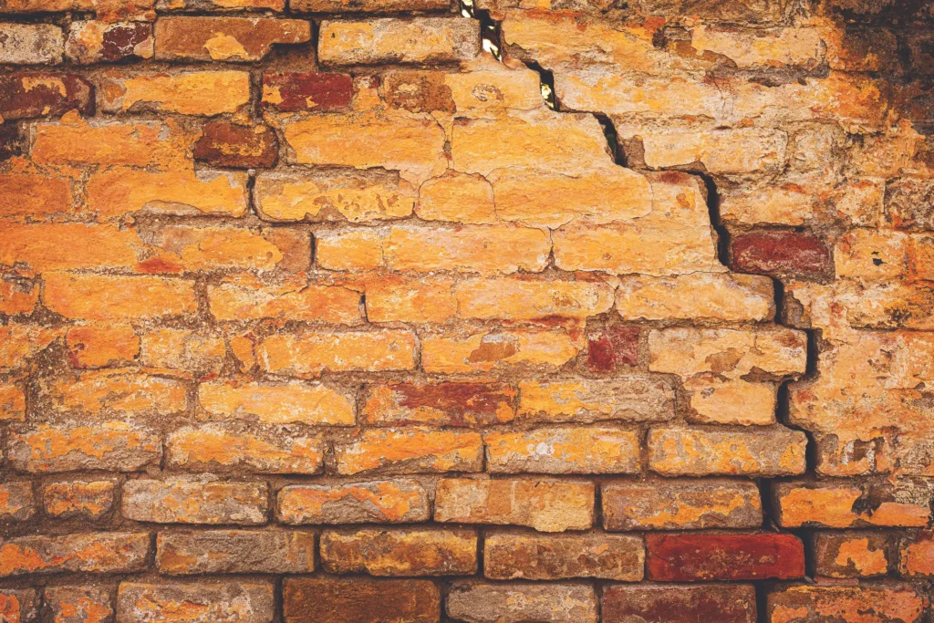 How to Prevent Foundation Settlement - A Brick Wall Cracked from Foundation Settlement