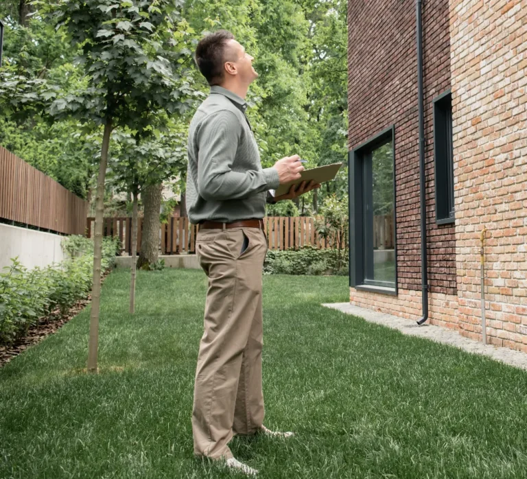 Sagging Floor Repair Contractors - A Contractor Inspecting for Signs of Foundation Damage