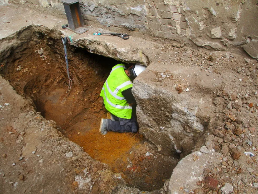 Underpinning for House Foundation - A Picture of Construction Workers Underpinning a House