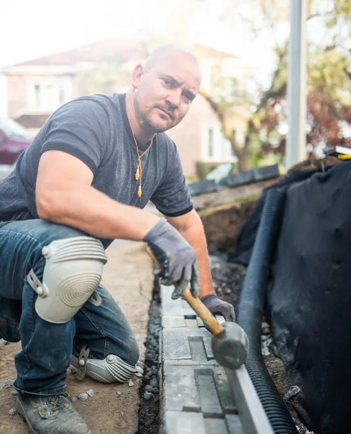 Retaining Wall Support - A Contractor Building a Retaining Wall