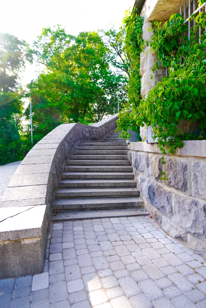 Limestone Retaining Wall - A Retaining Wall with a Staircase in Front of a Commercial Building