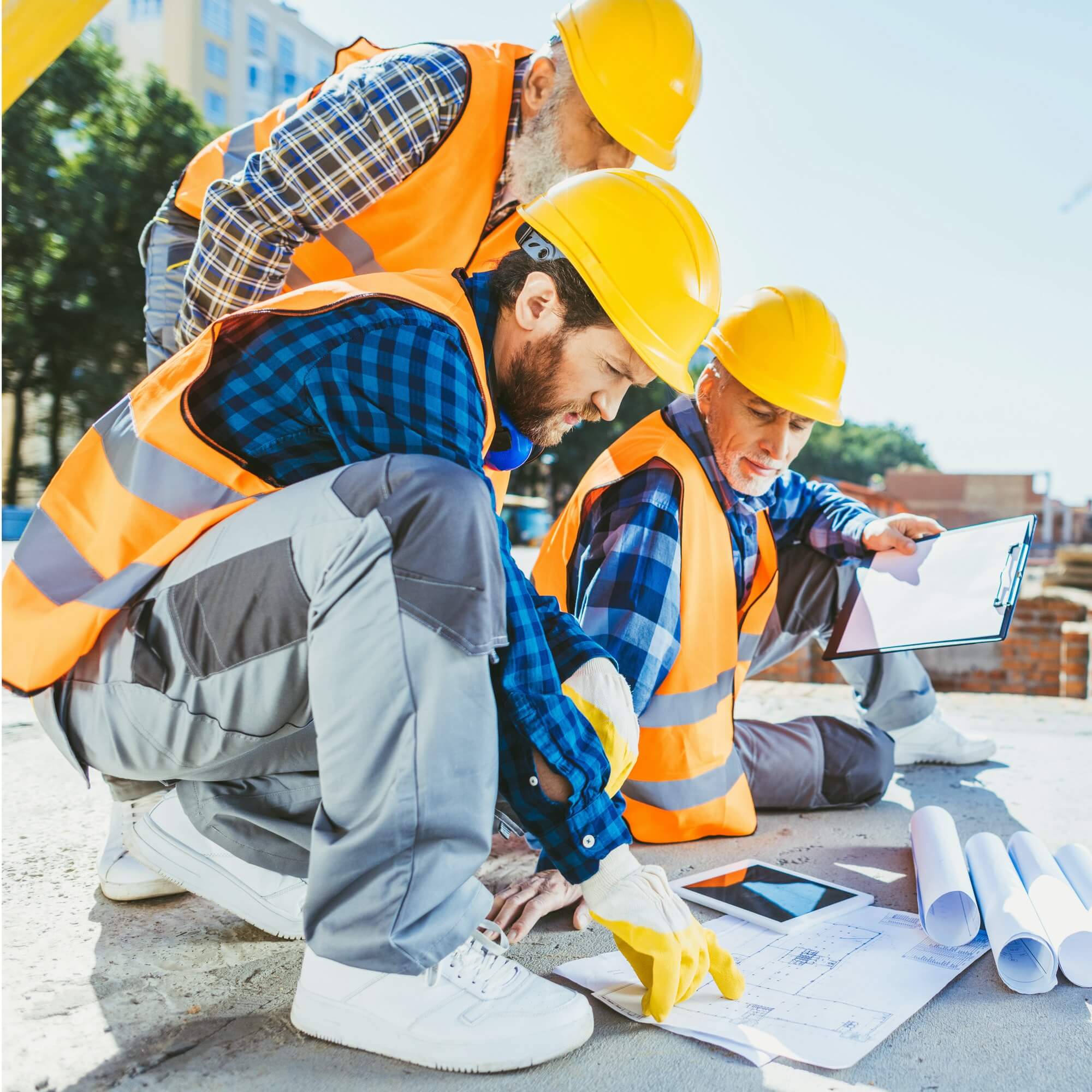 Concrete Block Retaining Wall Guide - Three Construction Workers Planning a Design