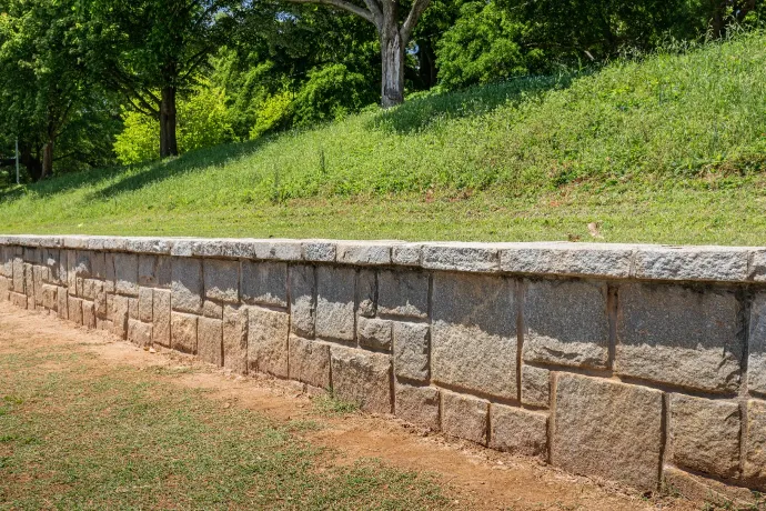 Anchored Retaining Walls Guide - An Anchored Retaining Wall Holding Up a Slope Near a Park